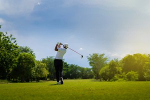 Asian,Man,Golfing,On,The,Course.,In,Summer